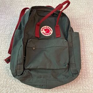 Dark green and red Fjallraven Kanken